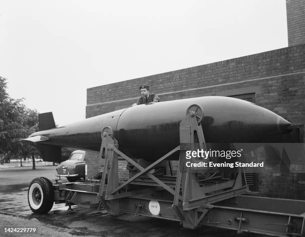 Member of military personnel with the 'Grand Slam, ' a 22, 000lb 'earthquake bomb' mounted on a carriage at RAF Abingdon near Abingdon, Oxfordshire....