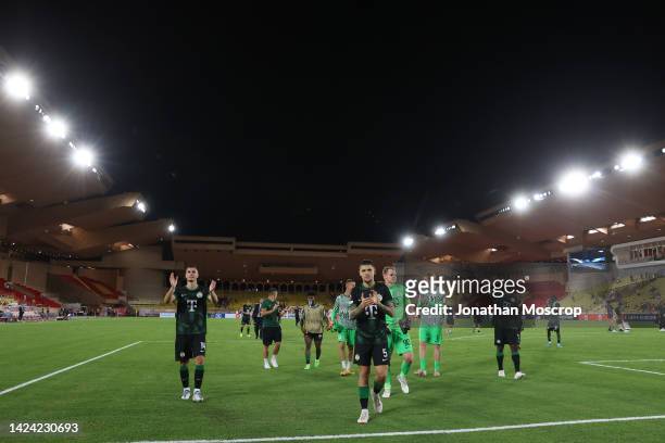 Ferencvarosi players celebrate in front of fans following the final whistle of the UEFA Europa League group H match between AS Monaco and...