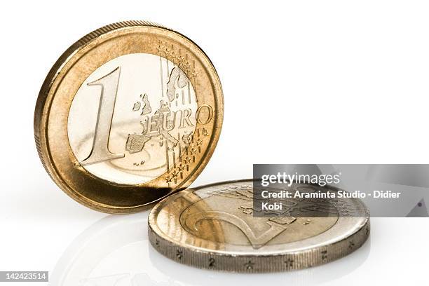 euro coins over white background - moneta da un euro foto e immagini stock