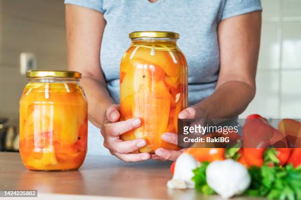 preserving organic vegetables in jars  for winter. - winter jam stock pictures, royalty-free photos & images