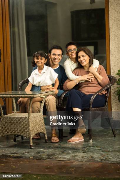 happy family spending leisure time at terrace - family india stock pictures, royalty-free photos & images