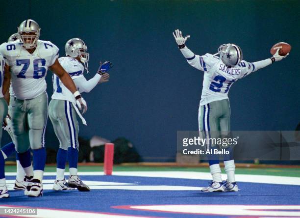 Deion Sanders, Wide Receiver for the Dallas Cowboys celebrates a touch down in the end zone during their National Football Conference East Division...
