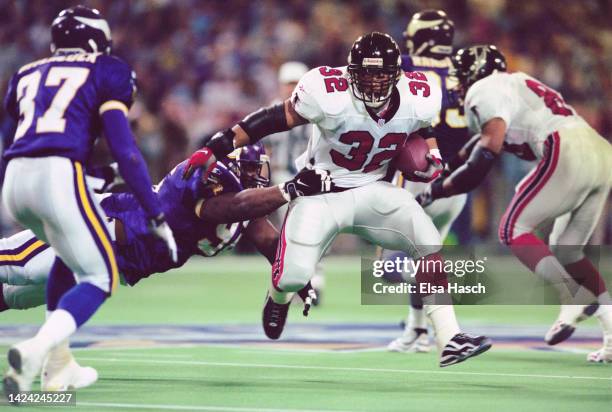 Jamal Anderson, Running Back for the Atlanta Falcons in motion running the football during the National Football Conference Championship game against...