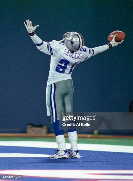 Deion Sanders, Wide Receiver for the Dallas Cowboys celebrates a touch down in the end zone during their National Football Conference East Division...