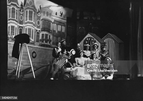Princess Elizabeth and Princess Margaret performing on stage during the '1890 Naughty Nineties Ballet' scene in a royal pantomime production of 'Old...