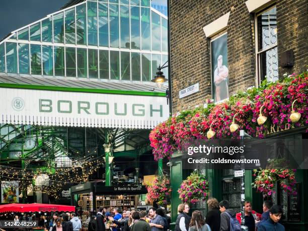 entrance to borough market with crowd of people in london, uk - borough market 個照片及圖片檔