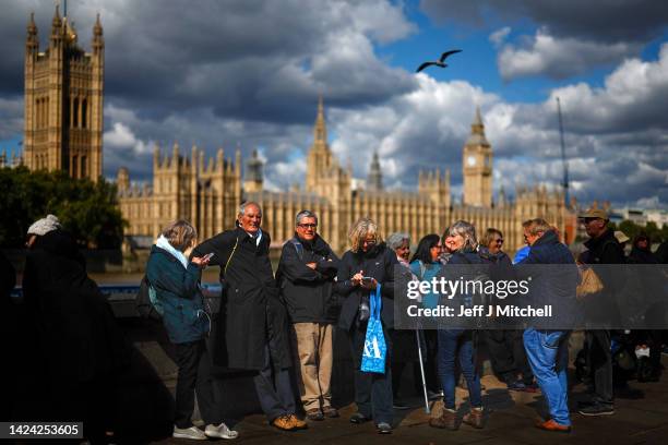 Members of the public stand in the queue opposite the Houses of Parliament for the Lying-in State of Queen Elizabeth II on September 16, 2022 in...