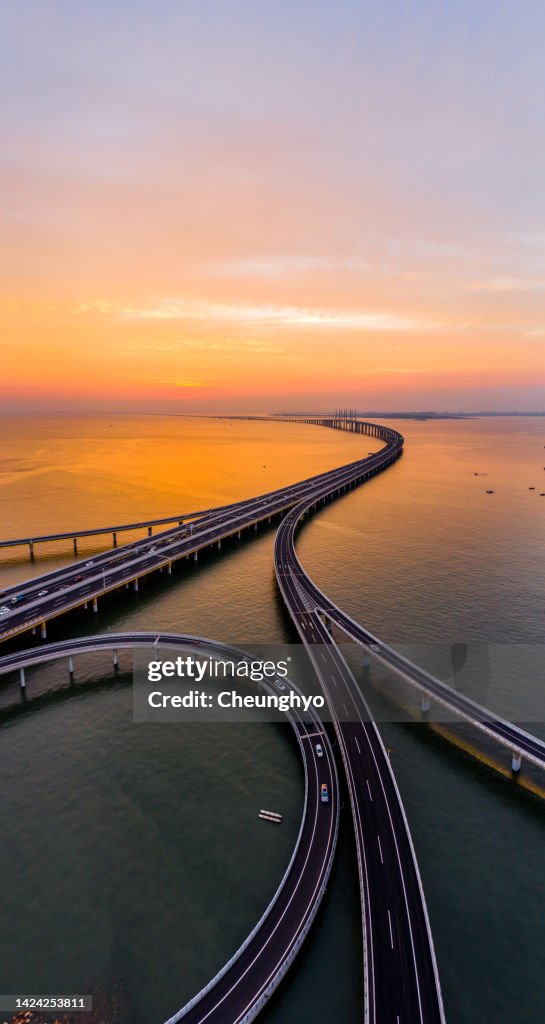 Drone Point View of Jiaozhou Bay Bridge at the Colorful Sunset, Qingdao City, Shandong Province, China