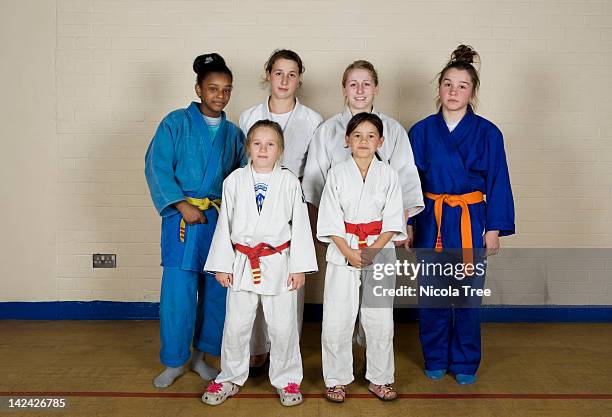 a group shot of girls from the junior judo club. - girl martial arts stock pictures, royalty-free photos & images
