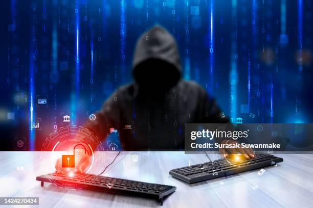 faceless hackers and malware hackers use laptops with dangerous digital code on binary code background. - stolen identity stock pictures, royalty-free photos & images