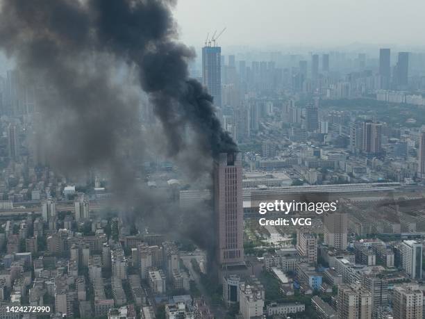 Flames and smoke rise from a 218-meter-tall office building on September 16, 2022 in Changsha, Hunan Province of China. A major fire broke out in the...