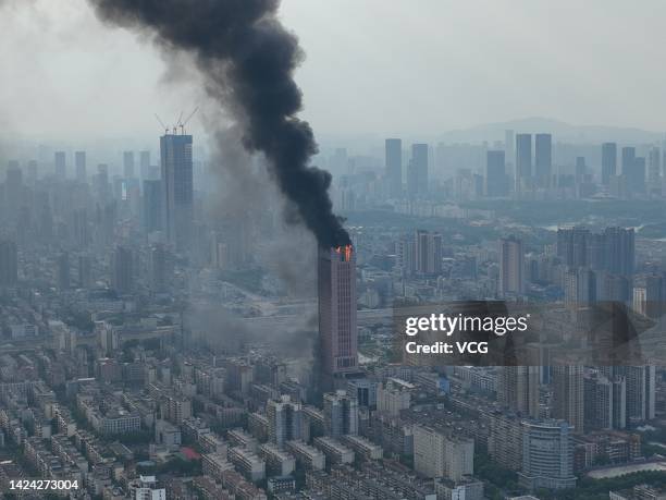 Flames and smoke rise from a 218-meter-tall office building on September 16, 2022 in Changsha, Hunan Province of China. A major fire broke out in the...