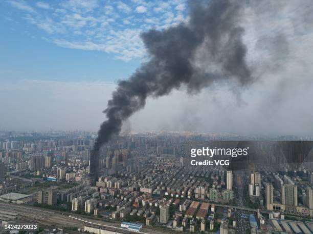 Flames and smoke rise from a 218-meter-tall office building on September 16, 2022 in Changsha, Hunan Province of China. A major fire broke out in the...