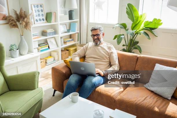 mature man working from home - middle aged man facetime stock pictures, royalty-free photos & images