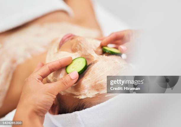 facial mask, cucumber skincare and spa in zen wellness, luxury massage or healthcare peace room. zoom on women, masseuse or worker hands with eye care vegetable in beauty salon for relax sleep on bed - cucumber eye mask stock pictures, royalty-free photos & images