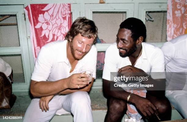 England captain Ian Botham pictured laughing and sharing a drink with West Indies player Viv Richards after the 3rd Test Match between West Indies...