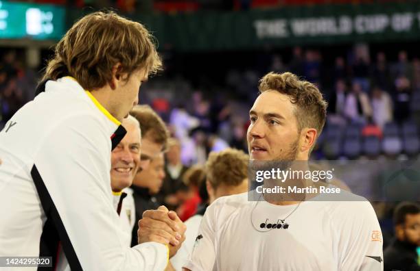 Jan-Lennard Struff of Germany celebrate victory with team mate Alexander Zverev after defeating Zizou Bergs of Belgium during the Davis Cup Group...