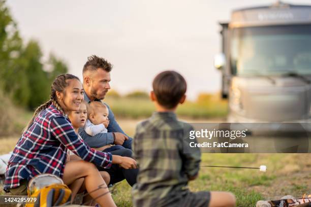 rv camping with the family - bus fire stock pictures, royalty-free photos & images