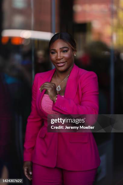 Serena Williams seen wearing a pink shiny top, a pink blazer and pink matching pants outside Michael Kors during New York Fashion Week on September...