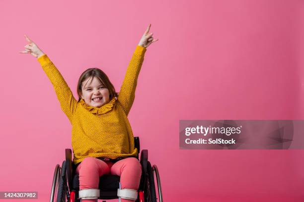 rock out! - wheelchair stock pictures, royalty-free photos & images