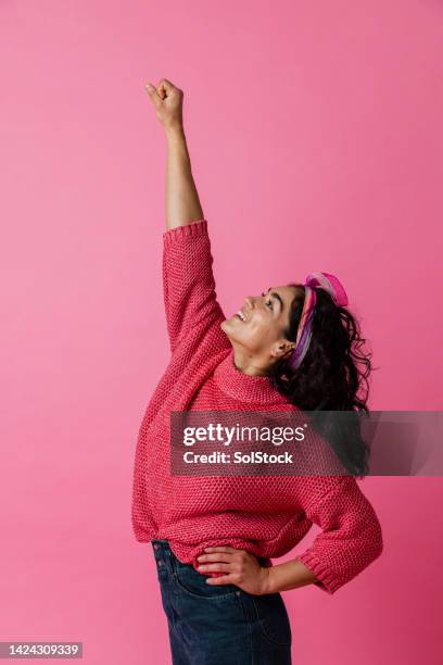 pose like superman - colour background and young adult stock pictures, royalty-free photos & images