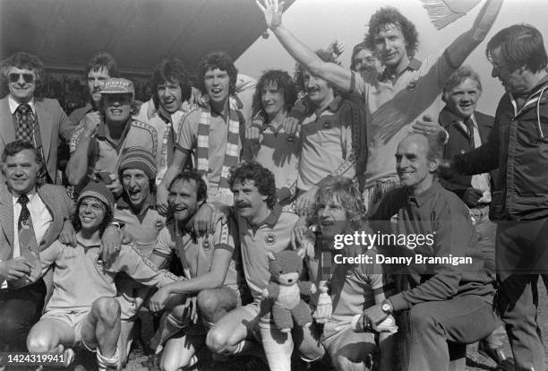 Brighton & Hove Albion players and staffincluding Peter Ward Brian Horton Manager Alan Mullery Mark Lawrenson celebrate their 3-1 Second Division win...