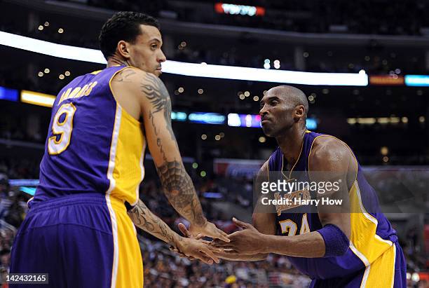 Kobe Bryant and Matt Barnes of the Los Angeles Lakers celebrate a defensive stop against the Los Angeles Clippers at Staples Center on April 4, 2012...