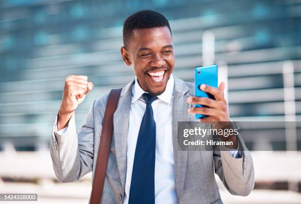city businessman, happy fist and phone notification email with exciting news about work deal. urban corporate person with happiness, surprise and satisfaction with success for career promotion. - rewards program stock pictures, royalty-free photos & images