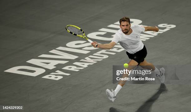 Oscar Otte of Germany plays a forehand against David Goffin of Belgium during the Davis Cup Group Stage 2022 Hamburg match between Germany and...