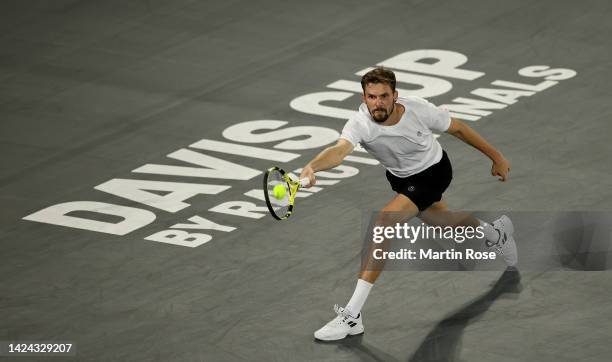 Oscar Otte of Germany plays a forehand against David Goffin of Belgium during the Davis Cup Group Stage 2022 Hamburg match between Germany and...