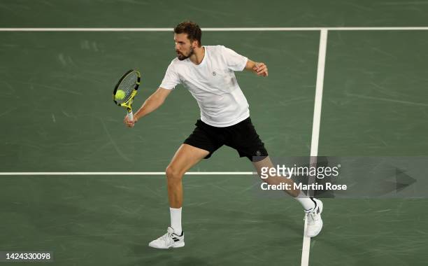 Oscar Otte of Germany plays a backhand against David Goffin of Belgium during the Davis Cup Group Stage 2022 Hamburg match between Germany and...
