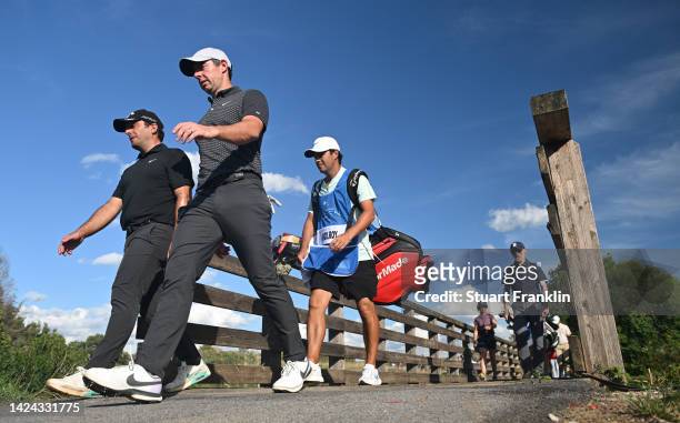 Rory McIlroy of Northern Ireland and Francesco Molinari of Italy walk down the 9th hole on Day Two of the DS Automobiles Italian Open 2022 at Marco...