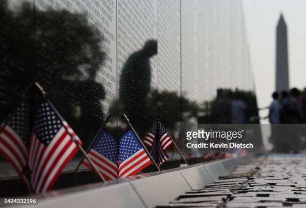 American flags are seen at the Vietnam Veterans Memorial on National POW/MIA Recognition Day on the National Mall on September 16, 2022 in...