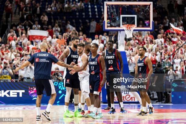 Players of France celebrate after the FIBA EuroBasket 2022 semi-final match between Poland and France at EuroBasket Arena Berlin on September 16,...