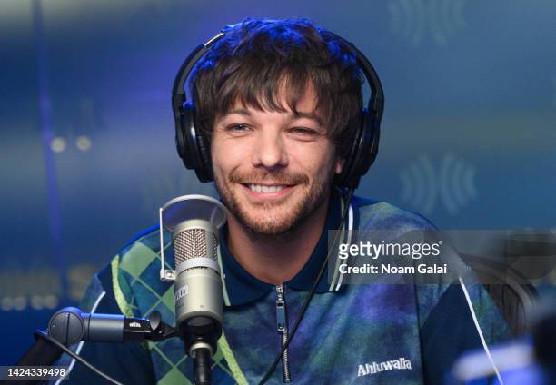 Louis Tomlinson visits 'Hits 1' with Nicole Ryan and Ryan Sampson at the SiriusXM Studios on September 16, 2022 in New York City.