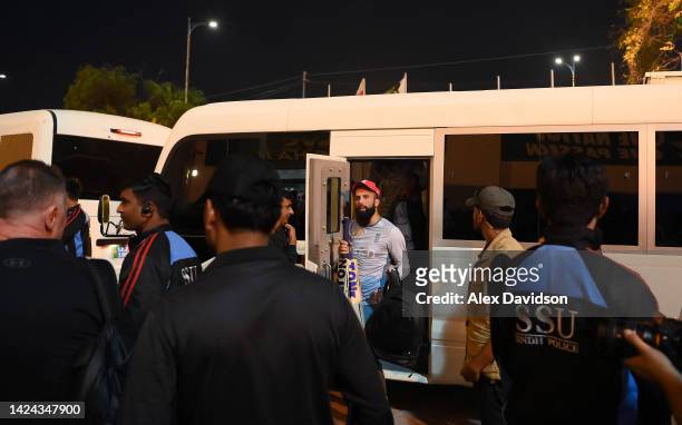 Moeen Ali of England gets off the team bus as security survey the area during a England Nets Session at the National Stadium on September 16, 2022 in...