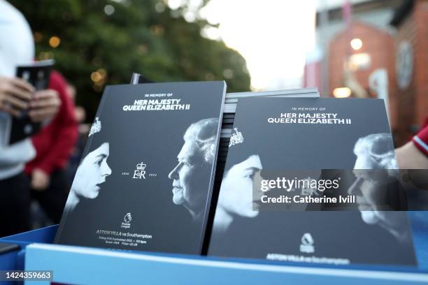 Match day programmes are seen being sold with a tribute to Her Majesty Queen Elizabeth II, who died away at Balmoral Castle on September 8 prior to...