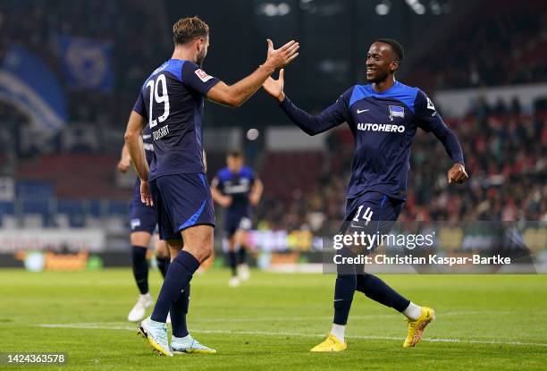 Lucas Tousart of Hertha Berlin celebrates with Dodi Lukebakio after scoring their sides first goal during the Bundesliga match between 1. FSV Mainz...