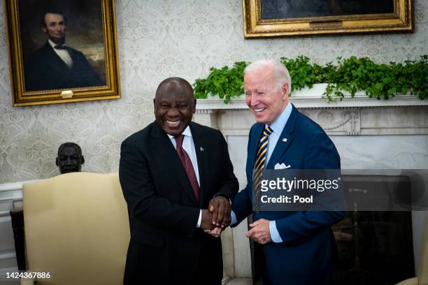 President Joe Biden shakes hands with South African President Cyril Ramaphosa during a bilateral meeting in the Oval Office of the White House on...