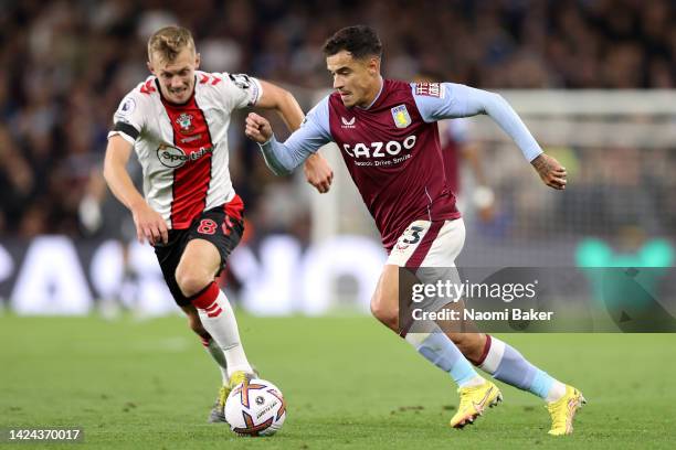 Philippe Coutinho of Aston Villa runs with the ball whilst under pressure from James Ward-Prowse of Southampton during the Premier League match...