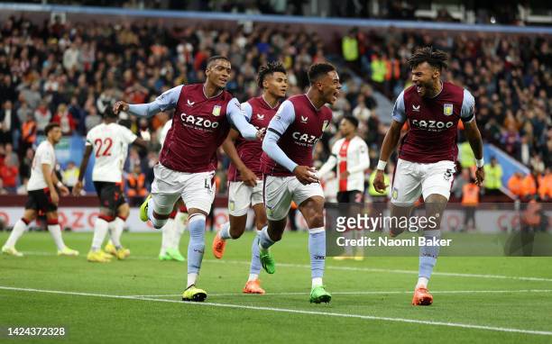 Jacob Ramsey of Aston Villa celebrates after scoring their side's first goal with Tyrone Mings and team mates during the Premier League match between...