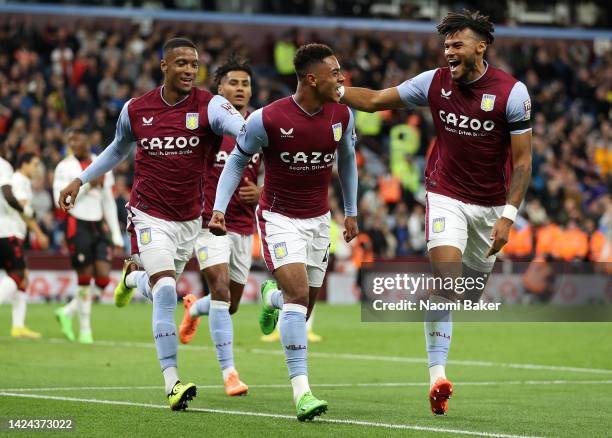 Jacob Ramsey of Aston Villa celebrates after scoring their side's first goal with Tyrone Mings and team mates during the Premier League match between...