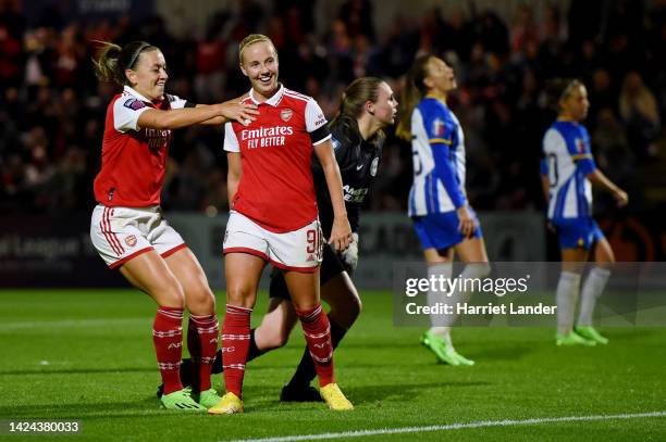 Beth Mead of Arsenal celebrates with team mate Katie McCabe after scoring their sides fourth goal during the FA Women's Super League match between...