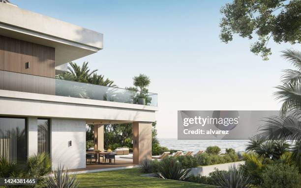 modern villa with two floors overlooking sea - hotel grounds stock pictures, royalty-free photos & images