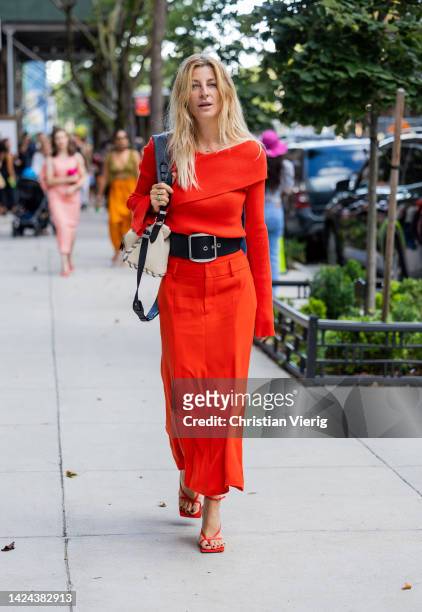 Ada Kokosar wearing red skirt, black belt, red top outside Jonathan Simkhai on September 13, 2022 in New York City.