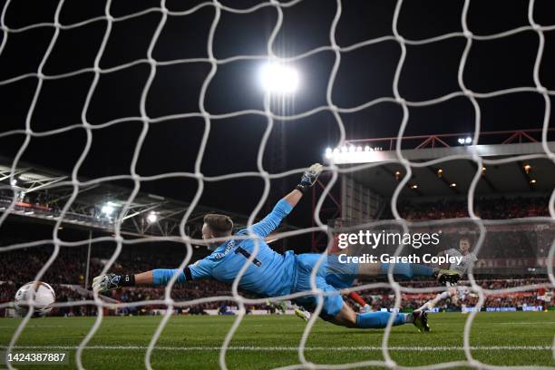 Harrison Reed of Fulham scores their team's third goal past Dean Henderson of Nottingham Forest during the Premier League match between Nottingham...