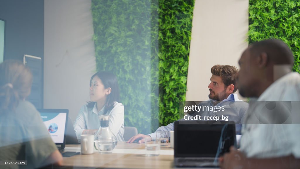 Business people having business meeting in meeting room in modern office working space
