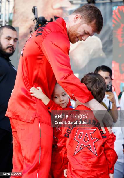 Canelo Alvarez of Mexico embraces daughter Maria Fernanda and son Saul Adiel after their ceremonial weigh-in at Toshiba Plaza on September 16, 2022...