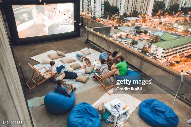 rooftop open-air cinema experience - bean bag stock pictures, royalty-free photos & images