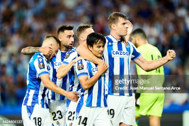 Alexander Sorloth of Real Sociedad celebrates with Takefusa Kubo and teammates after scoring their side's second goal during the UEFA Europa League...